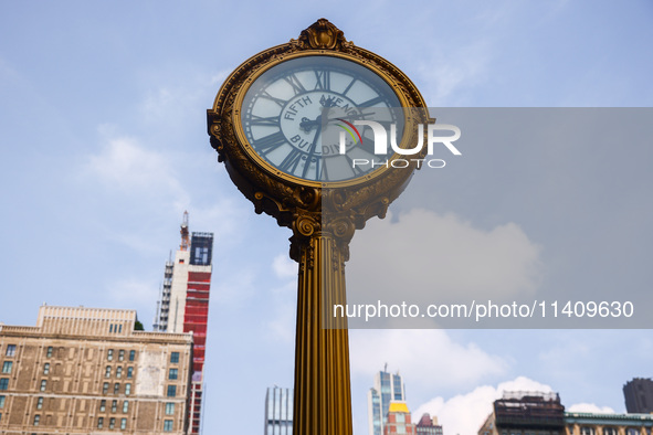 Fifth Avenue Building Gold Clock in Flatiron district in New York City, United States of America on July 5th, 2024. 