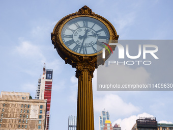 Fifth Avenue Building Gold Clock in Flatiron district in New York City, United States of America on July 5th, 2024. (