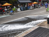 Water flow from a water pump in Manhattan, New York City, United States of America on July 5th, 2024. (