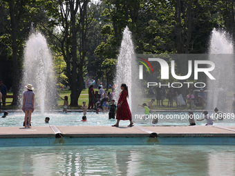 People are cooling off in the water on Centre Island on a hot day in Toronto, Ontario, Canada, on July 13, 2024. (