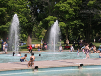 People are cooling off in the water on Centre Island on a hot day in Toronto, Ontario, Canada, on July 13, 2024. (