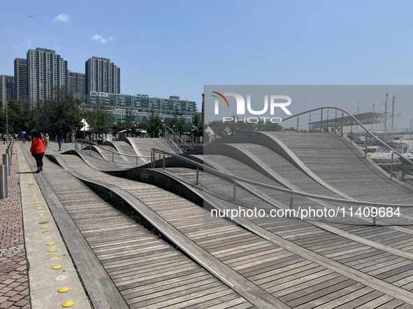 A wavy walkway is appearing at Harbourfront in Toronto, Ontario, Canada, on July 13, 2024. 