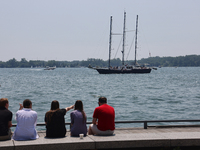 People are admiring boats along Harbourfront in Toronto, Ontario, Canada, on July 13, 2024. (