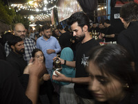 An Iraqi man living in Iran is serving donated Arabian coffee for worshippers during a religious rally to commemorate Tasoua, in Dolatabad n...