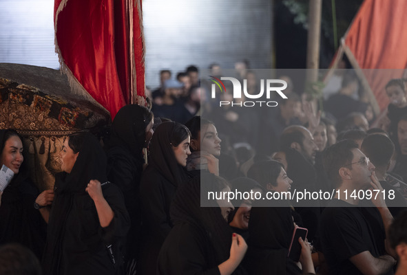 Female worshippers are participating in a religious rally to commemorate Tasoua in the Dolatabad neighborhood in southern Tehran, Iran, on J...