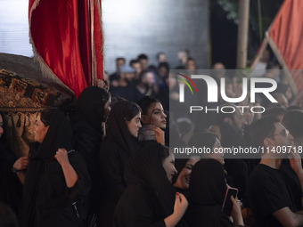 Female worshippers are participating in a religious rally to commemorate Tasoua in the Dolatabad neighborhood in southern Tehran, Iran, on J...