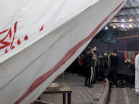 Iraqi men living in Iran are preparing to perform in a religious rally to commemorate Tasoua, in Dolatabad neighborhood in southern Tehran,...