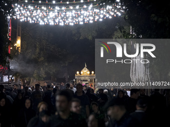 A religious symbol is being pictured during a religious rally to commemorate Tasoua in the Dolatabad neighborhood in southern Tehran, Iran,...