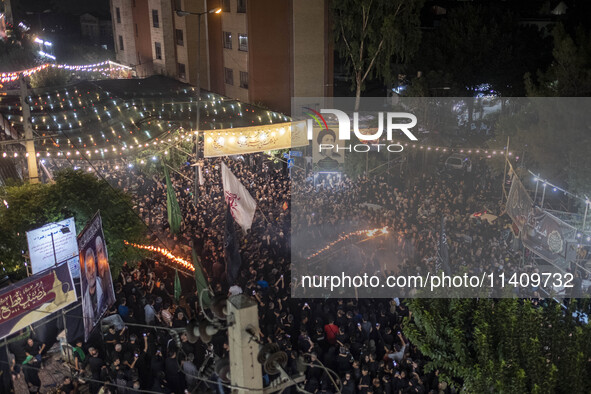 Iraqi worshippers living in Iran are performing with fire during a religious rally to commemorate Tasoua in the Dolatabad neighborhood in so...