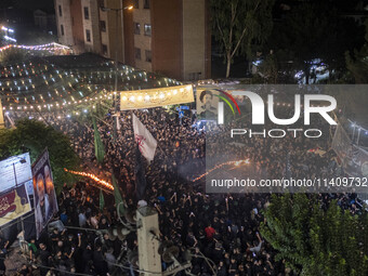 Iraqi worshippers living in Iran are performing with fire during a religious rally to commemorate Tasoua in the Dolatabad neighborhood in so...