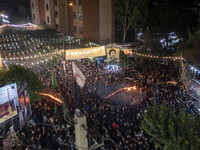 Iraqi worshippers living in Iran are performing with fire during a religious rally to commemorate Tasoua in the Dolatabad neighborhood in so...