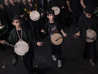 Iraqi young boys living in Iran are performing in a religious rally to commemorate Tasoua, in Dolatabad neighborhood in southern Tehran, Ira...