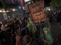 A young Iraqi boy living in Iran is riding a horse while performing in a religious rally to commemorate Tasoua, in Dolatabad neighborhood in...