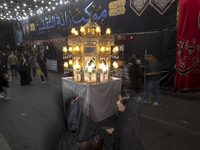 A religious symbol is being pictured during a religious rally to commemorate Tasoua in the Dolatabad neighborhood in southern Tehran, Iran,...