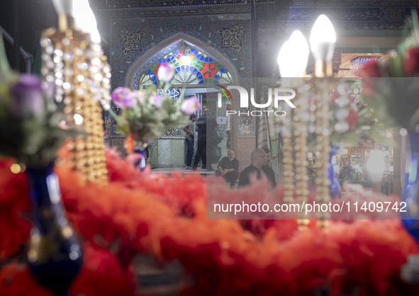 An Iraqi man living in Iran is sitting just outside a mosque during a religious rally to commemorate Tasoua, in Dolatabad neighborhood in so...