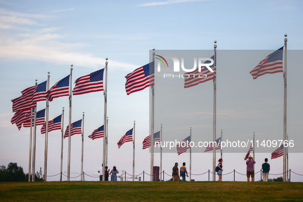 American flags by Washington Monument in Washington, DC in the United States of America on July 9th, 2024. 