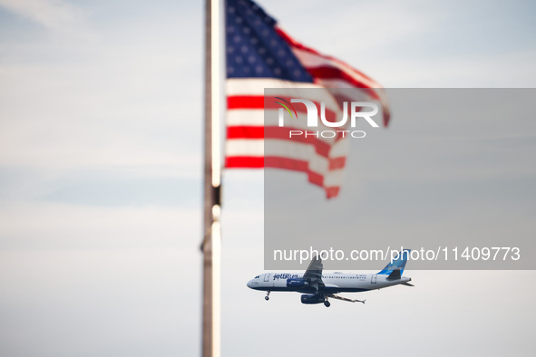 JetBlue airplane is seen flying over Washington, DC in the United States of America on July 9th, 2024. 