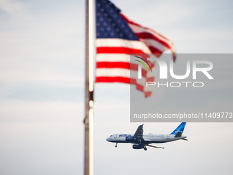 JetBlue airplane is seen flying over Washington, DC in the United States of America on July 9th, 2024. (