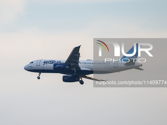 JetBlue airplane is seen flying over Washington, DC in the United States of America on July 9th, 2024. (