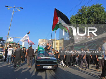 Thousands of Shia Muslims are attending the mourning procession to commemorate the martyrdom of Prophet Muhammad's grandson Imam Hussein (Hu...