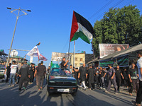 Thousands of Shia Muslims are attending the mourning procession to commemorate the martyrdom of Prophet Muhammad's grandson Imam Hussein (Hu...