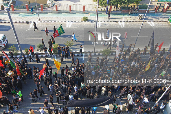 Thousands of Shia Muslims are attending the mourning procession to commemorate the martyrdom of Prophet Muhammad's grandson Imam Hussein (Hu...