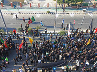 Thousands of Shia Muslims are attending the mourning procession to commemorate the martyrdom of Prophet Muhammad's grandson Imam Hussein (Hu...