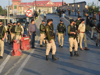 Indian police officers are taking security measures as thousands of Shia Muslims are attending the mourning procession to commemorate the ma...