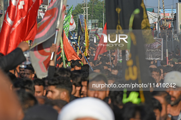 Thousands of Shia Muslims are attending the mourning procession to commemorate the martyrdom of Prophet Muhammad's grandson Imam Hussein (Hu...