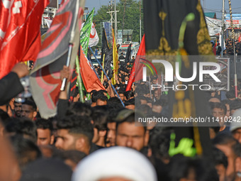 Thousands of Shia Muslims are attending the mourning procession to commemorate the martyrdom of Prophet Muhammad's grandson Imam Hussein (Hu...