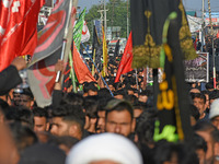 Thousands of Shia Muslims are attending the mourning procession to commemorate the martyrdom of Prophet Muhammad's grandson Imam Hussein (Hu...