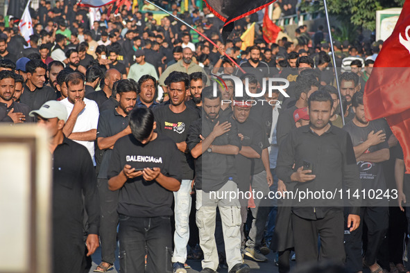 Thousands of Shia Muslims are attending the mourning procession to commemorate the martyrdom of Prophet Muhammad's grandson Imam Hussein (Hu...