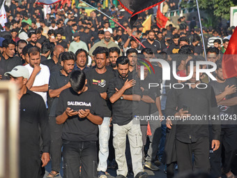 Thousands of Shia Muslims are attending the mourning procession to commemorate the martyrdom of Prophet Muhammad's grandson Imam Hussein (Hu...