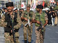 Indian paramilitary soldiers are patrolling the street as thousands of Shia Muslims are attending the mourning procession to commemorate the...