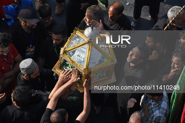 Thousands of Shia Muslims are attending the mourning procession to commemorate the martyrdom of Prophet Muhammad's grandson Imam Hussein (Hu...