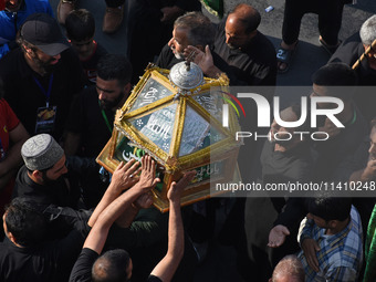 Thousands of Shia Muslims are attending the mourning procession to commemorate the martyrdom of Prophet Muhammad's grandson Imam Hussein (Hu...