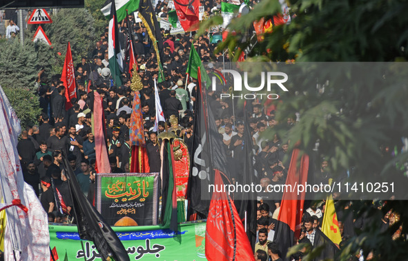 Thousands of Shia Muslims are attending the mourning procession to commemorate the martyrdom of Prophet Muhammad's grandson Imam Hussein (Hu...