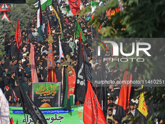 Thousands of Shia Muslims are attending the mourning procession to commemorate the martyrdom of Prophet Muhammad's grandson Imam Hussein (Hu...