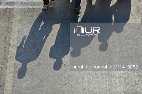 Kashmiri Shia mourners are walking as thousands of Shia Muslims are attending the mourning procession to commemorate the martyrdom of Prophe...