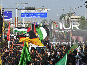 Thousands of Shia Muslims are attending the mourning procession to commemorate the martyrdom of Prophet Muhammad's grandson Imam Hussein (Hu...