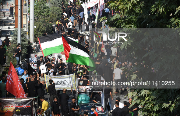 Thousands of Shia Muslims are attending the mourning procession to commemorate the martyrdom of Prophet Muhammad's grandson Imam Hussein (Hu...