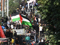 Thousands of Shia Muslims are attending the mourning procession to commemorate the martyrdom of Prophet Muhammad's grandson Imam Hussein (Hu...