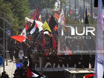 Thousands of Shia Muslims are attending the mourning procession to commemorate the martyrdom of Prophet Muhammad's grandson Imam Hussein (Hu...