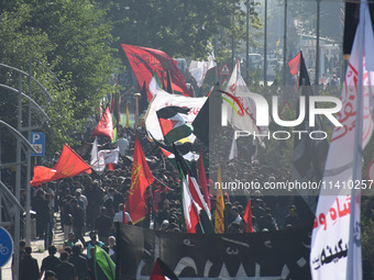 Thousands of Shia Muslims are attending the mourning procession to commemorate the martyrdom of Prophet Muhammad's grandson Imam Hussein (Hu...