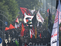 Thousands of Shia Muslims are attending the mourning procession to commemorate the martyrdom of Prophet Muhammad's grandson Imam Hussein (Hu...