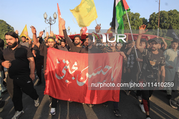 Thousands of Shia Muslims are attending the mourning procession to commemorate the martyrdom of Prophet Muhammad's grandson Imam Hussein (Hu...