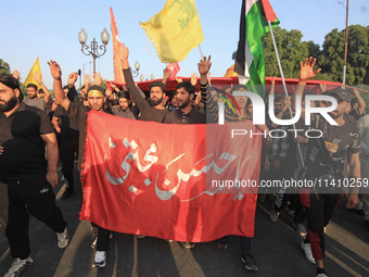 Thousands of Shia Muslims are attending the mourning procession to commemorate the martyrdom of Prophet Muhammad's grandson Imam Hussein (Hu...