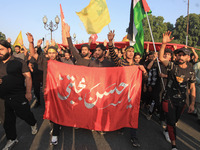 Thousands of Shia Muslims are attending the mourning procession to commemorate the martyrdom of Prophet Muhammad's grandson Imam Hussein (Hu...