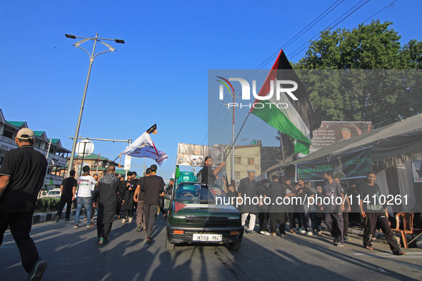 Thousands of Shia Muslims are attending the mourning procession to commemorate the martyrdom of Prophet Muhammad's grandson Imam Hussein (Hu...