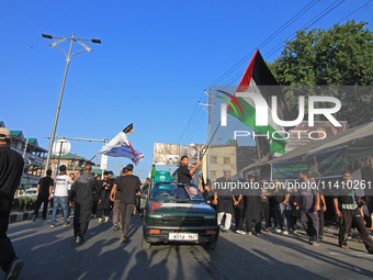 Thousands of Shia Muslims are attending the mourning procession to commemorate the martyrdom of Prophet Muhammad's grandson Imam Hussein (Hu...